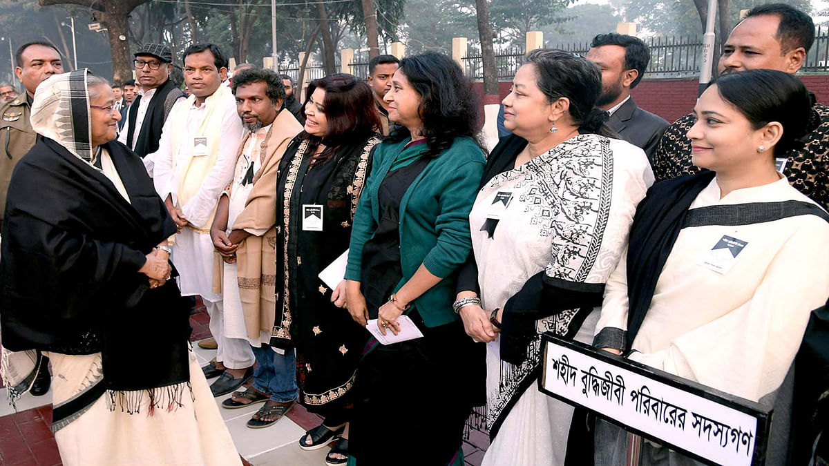Prime minister Sheikh Hasina talks to the family members of the martyred intellectuals after paying respect to the martyred intellectuals on the occasion of Martyred Intellectuals Day at the Martyred Intellectuals Memorial in Mirpur, Dhaka on 14 December 2019. Photo: PID
