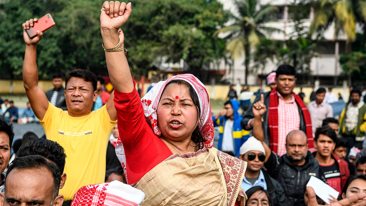 Demonstrators shout slogans during a protest against the government`s Citizenship Amendment Bill (CAB) in Guwahati on 13 December 2019. Internet access has been cut in India`s northeastern city of Guwahati after violent protests over a new citizenship law saw two demonstrators shot dead by police, authorities said on 13 December. Photo: AFP