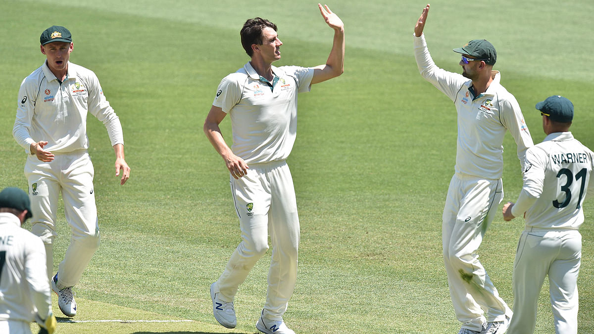 Australian fast bowler Pat Cummins (C) celebrates the wicket of New Zealand`s BJ Watling on day three of the first Test cricket match at the Perth Stadium in Perth on 14 December 2019. Photo: AFP