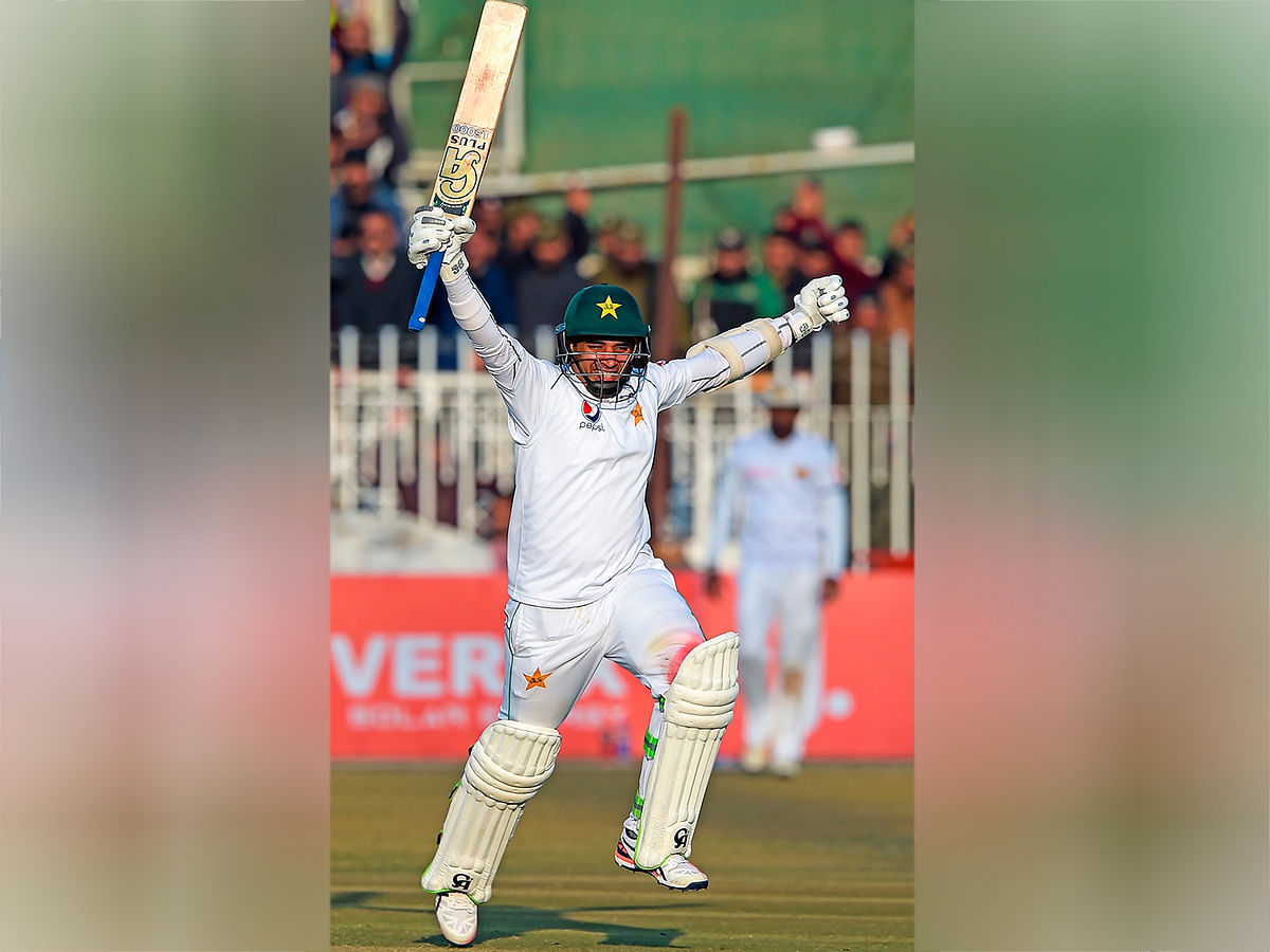 Pakistan`s Abid Ali celebrates after scoring a century (100 runs) during the fifth and final day of the first Test cricket match between Pakistan and Sri Lanka at the Rawalpindi Cricket Stadium in Rawalpindi on 15 December 2019. Photo: AFP