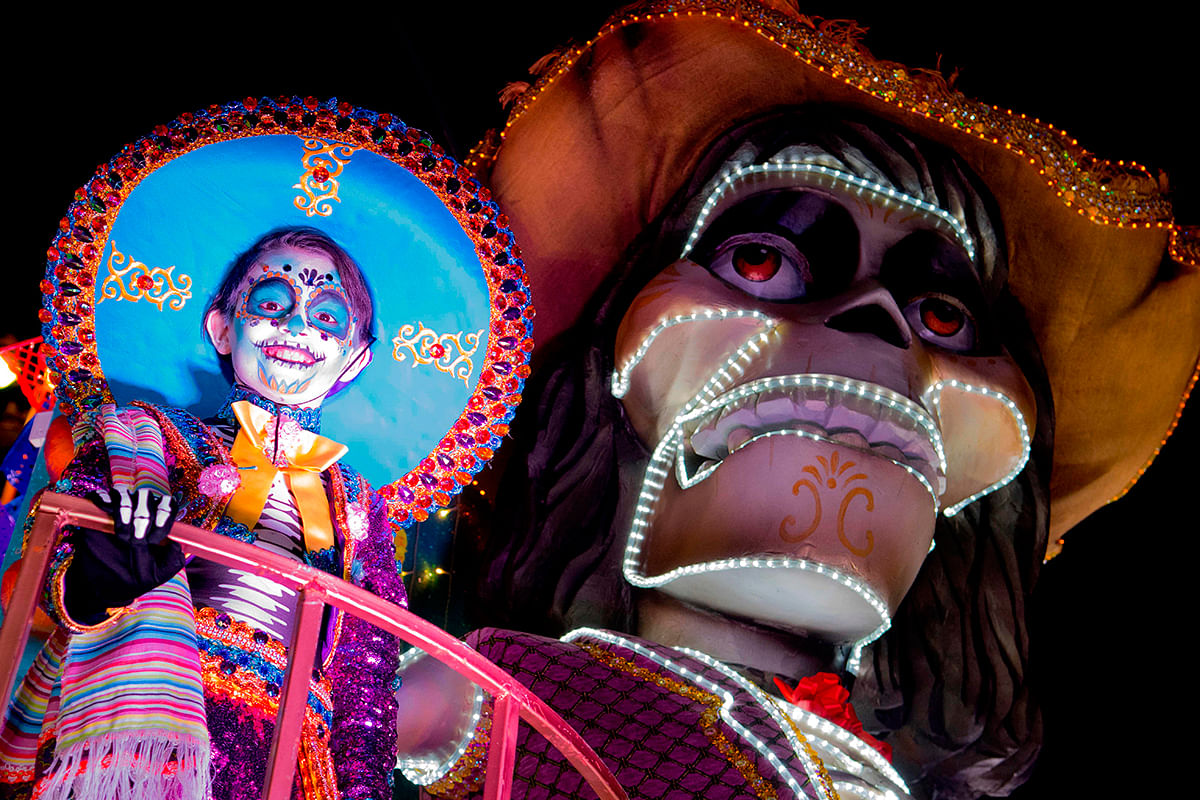 A reveler performs on a float during the Light Festival parade in San Jose, Costa Rica on 14 December 2019. Photo: AFP