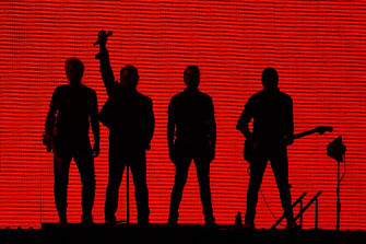 Irish rock band U2 perform during a concert at the DY Patil stadium in Navi Mumbai on 15 December, 2019. Photo: AFP