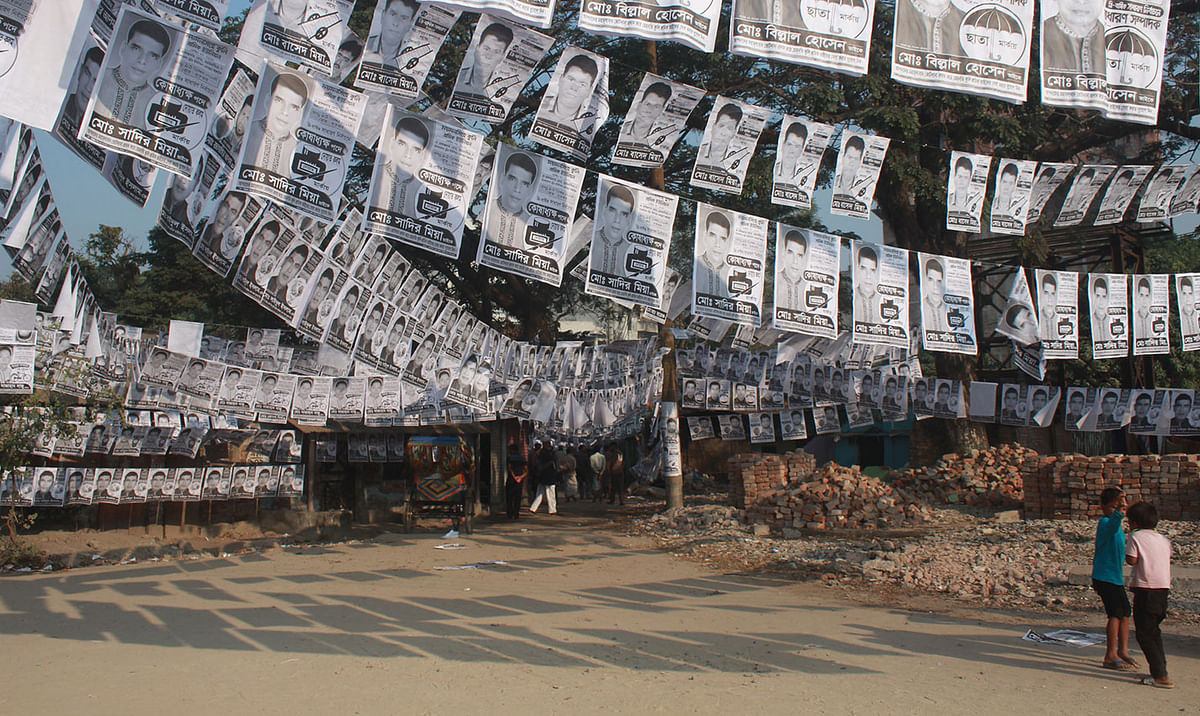 Posters hung at Malgudam, Mymensingh on 14 December 2019 ahead of the elections of the coolie workers union. Photo: Anwar Hossain