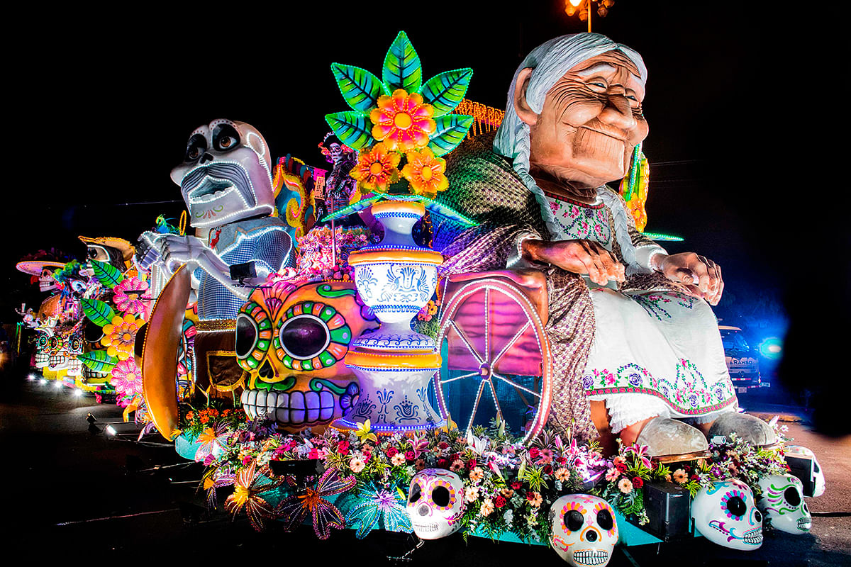 Artists perform on a float during the Light Festival parade in San Jose, Costa Rica on 14 December 2019. Photo: AFP