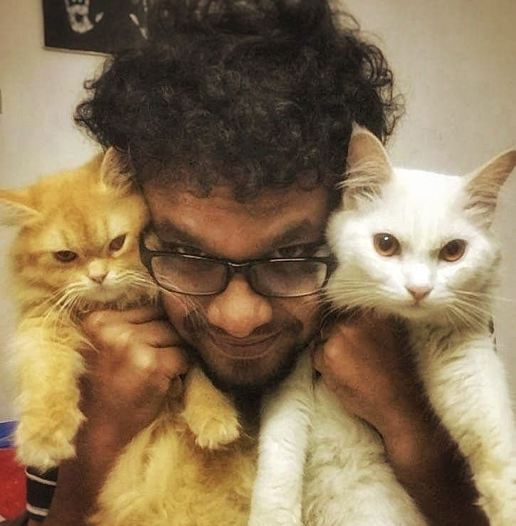 Prithwi Raj with his cats. Photo: Facebook of Prithi Raj