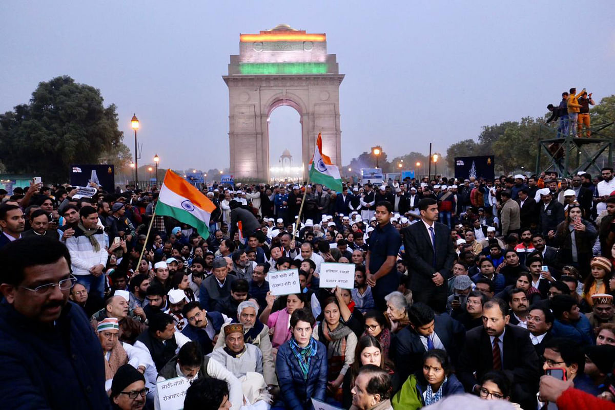 Congress general secretary Priyanka Gandhi Vadra sits in with party leaders and activists at India Gate, Delhi on 16 December 2019 to protest against the crackdown on Jamia Milia students. Photo: Congress Twitter Handle