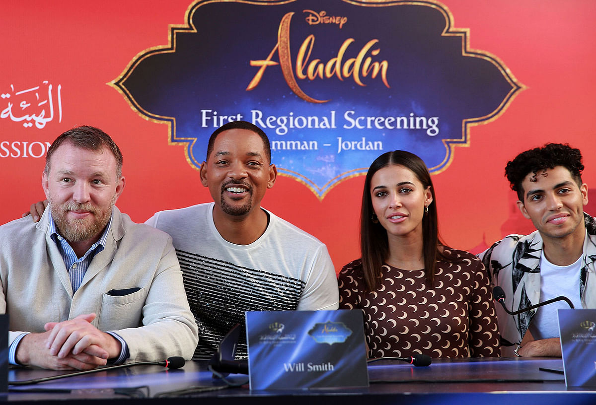 A picture taken on 13 May 2019 shows from (L to R) Director Guy Ritchie and cast members Will Smith, Naomi Scott and Mena Massoud of Disney`s live-action `Aladdin` attending a press conference in Jordan`s capital Amman. Photo: AFP