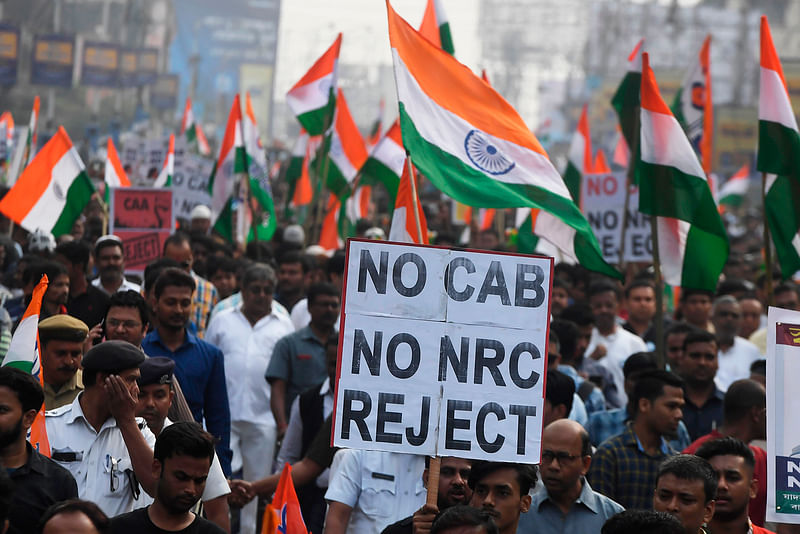 Supporters and activists of Trinamool Congress (TMC) participate in a mass rally attended by Chief minister of West Bengal state and leader of the Trinamool Congress (TMC) Mamata Banerjee (unseen), to protest against the Indian government`s Citizenship Amendment Act (CAA) in Kolkata on Tuesday. Photo: AFP