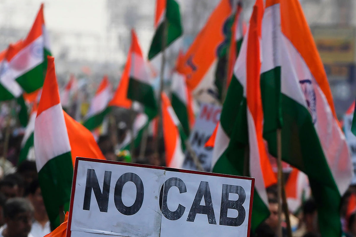 Supporters and activists of Trinamool Congress (TMC) participate in a mass rally attended by Chief minister of West Bengal state and leader of the Trinamool Congress (TMC) Mamata Banerjee (unseen), to protest against the Indian government`s Citizenship Amendment Act (CAA) in Kolkata. on 17 December 2019. Photo: AFP