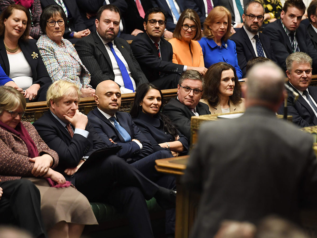 A handout picture taken and released by the UK Parliament in London on 17 December, shows Britain`s prime minister Boris Johnson (2L) listening in the House of Commons in London, during the first sitting of Parliament since the general election. Photo: AFP