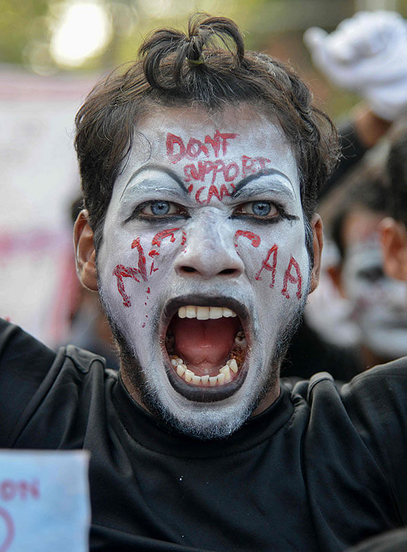 A protester shouts slogans during a protest against India`s new citizenship law in Guwahati on 18 December 2019. Photo: AFP