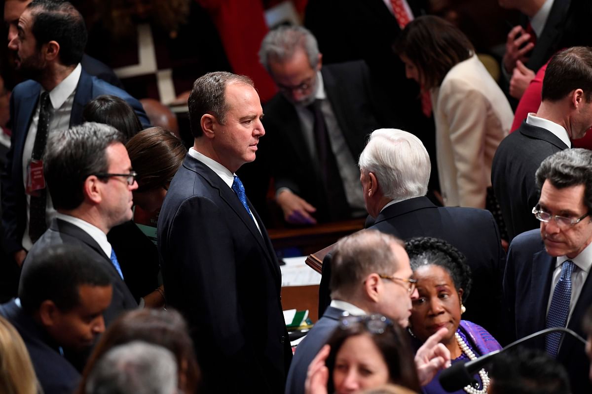 House Permanent Select Committee on Intelligence Chairman Adam Schiff (C) chats with colleagues as US Speaker of the House Nancy Pelosi presides over Resolution 755, Articles of Impeachment Against President Donald J. Trump as the House votes at the US Capitol in Washington, DC, on 18 December 2019. Photo: AFP