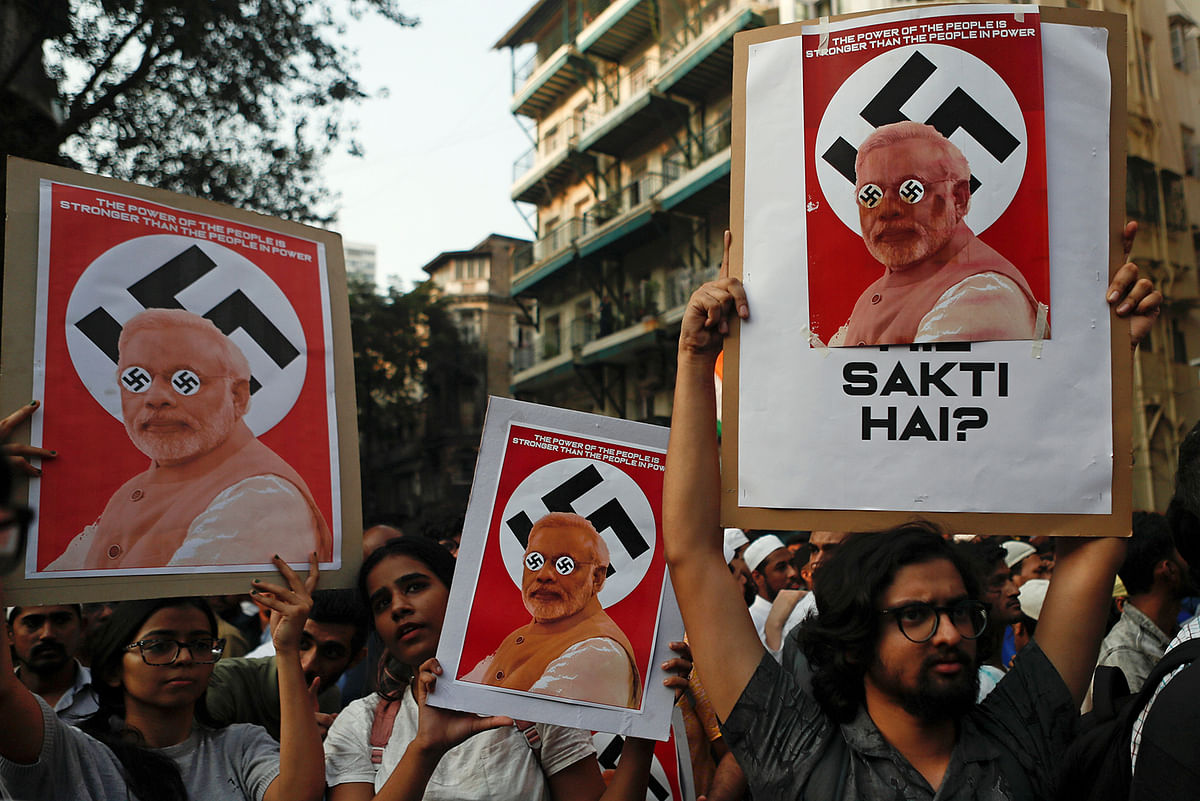Demonstrators hold placards during a protest against a new citizenship law, in Mumbai, India, on 19 December 2019. Photo: Reuters