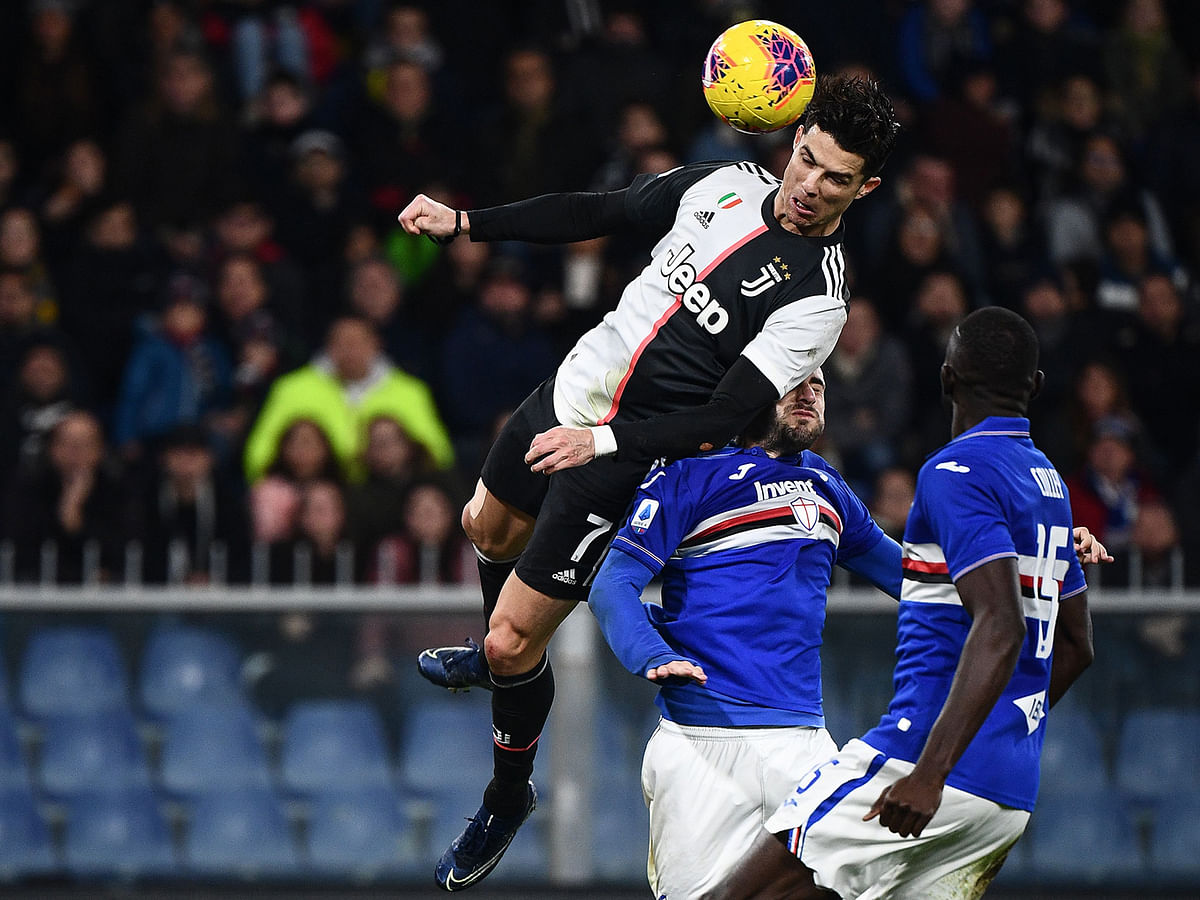 Juventus’ Portuguese forward Cristiano Ronaldo scores a header during the Italian Serie A football match Sampdoria vs Juventus on Wednesday at the Luigi-Ferraris stadium in Genoa. AFP