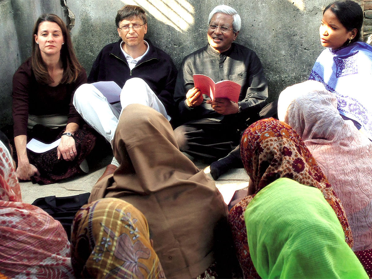 Fazle Hasan Abed interacts with women while visiting a BRAC programme in 2005 with Microsoft Corporation co-founder Bill Gates and Bill and Melinda Gates co-founder Melinda Gates. Photo: BRAC