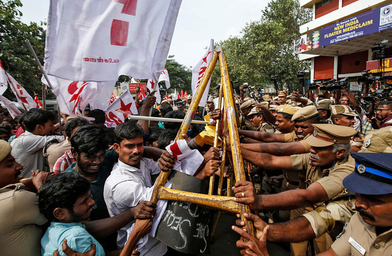 Police officers stop demonstrators during a protest against a new citizenship law, in Chennai, India, on 21 December 2019. Photo: Reuters