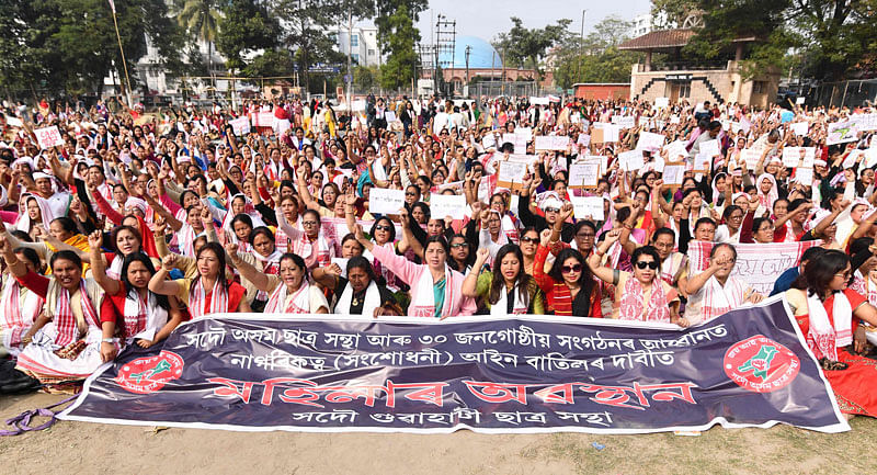 Female demonstrators shout slogans during a protest against India`s new citizenship law in Guwahati on 21 December 2019. Photo: AFP
