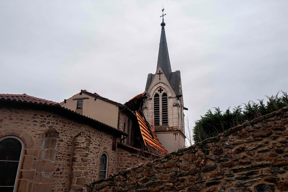 This picture taken on 20 December, shows the collapsed roof of La-Tour-en-Jarez church, near Saint-Etienne, central-eastern France, after high winds in the morning. Fourteen departments remain on orange alert by Meteo France on 20 December morning due to high winds and a risk of flooding and submersion in South-Eastern France. AFP FIle Photo