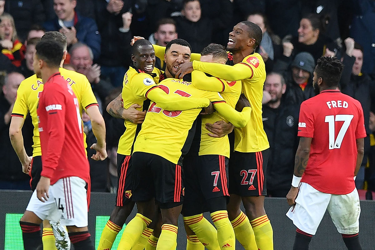 Watford`s Senegalese midfielder Ismaila Sarr (C) celebrates with teammates after scoring the opening goal of the English Premier League football match between Watford and Manchester United at Vicarage Road Stadium in Watford, north of London on Sunday. Photo: AFP