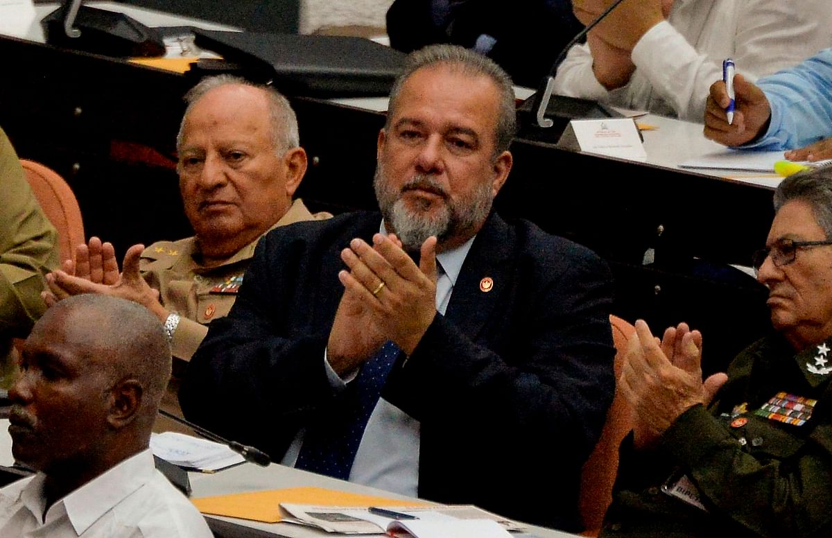 Newly appointed Cuban prime minister Manuel Marrero Cruz (C), attends the closing of the Fourth Regular Session of the National Assembly of Popular Power in its IX Legislature at the Convention Palace in Havana, on 21 December 2019. Photo: AFP