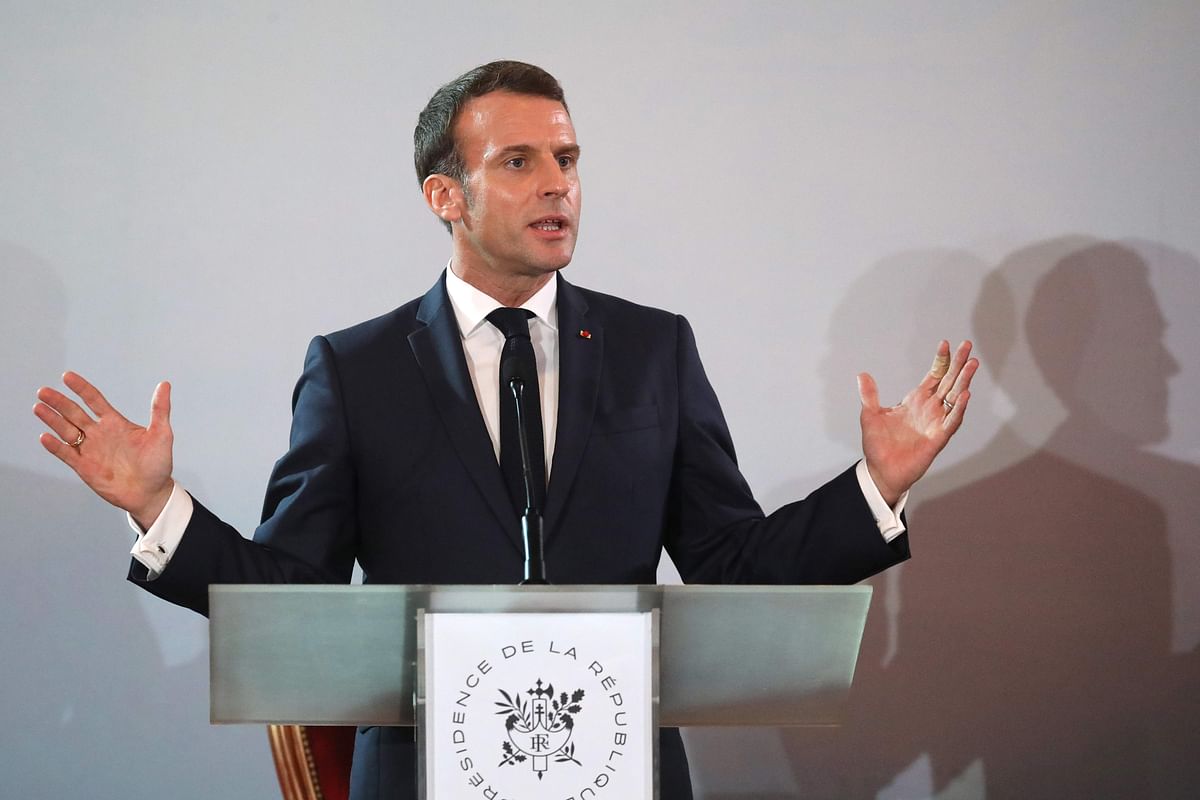 French president Emmanuel Macron speaks during a press conference at the Presidential Palace in Abidjan on 21 December, during a three day visit to West Africa. Photo: AFP