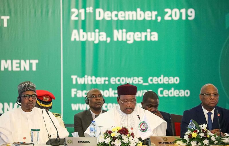 L-R: Nigeria president Muhammadu Buhari, Chairman, ECOWAS, Mahamadou Issoufou, and president of Ecowas Commission, Jean-Claude Kassi Brou attend the fifty-sixth ordinary session of the Economic Community of West African States in Abuja on 21 December 2019. Photo: AFP