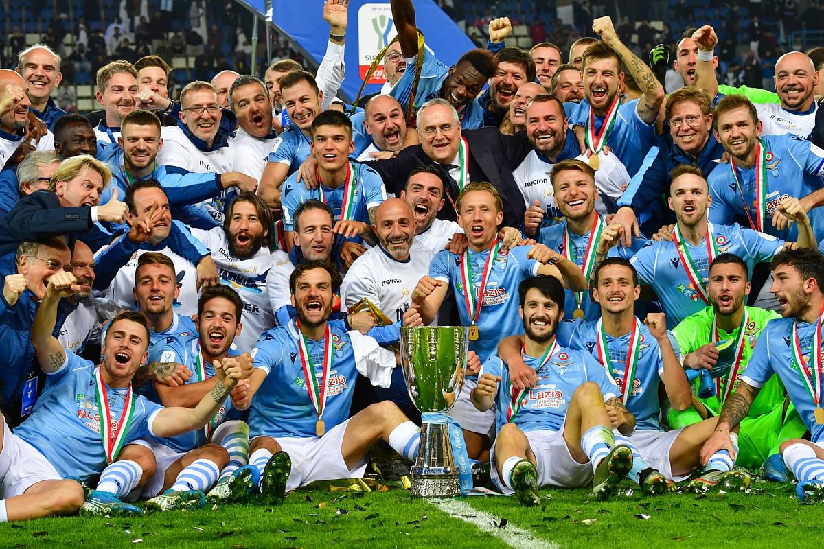 Lazio`s players celebrate with trophy after the Supercoppa Italiana final football match between Juventus and Lazio at the King Saud University Stadium in the Saudi capital Riyadh on Sunday. Photo: AFP