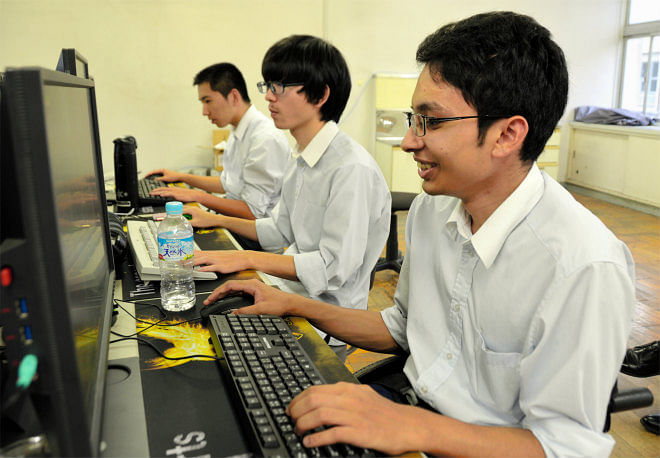 Rahat MD Majidul Hossain gives a shout after his eSports high school club successfully completes a play in Nagoya on 8 Oct. Photo: Asahi Shimbun