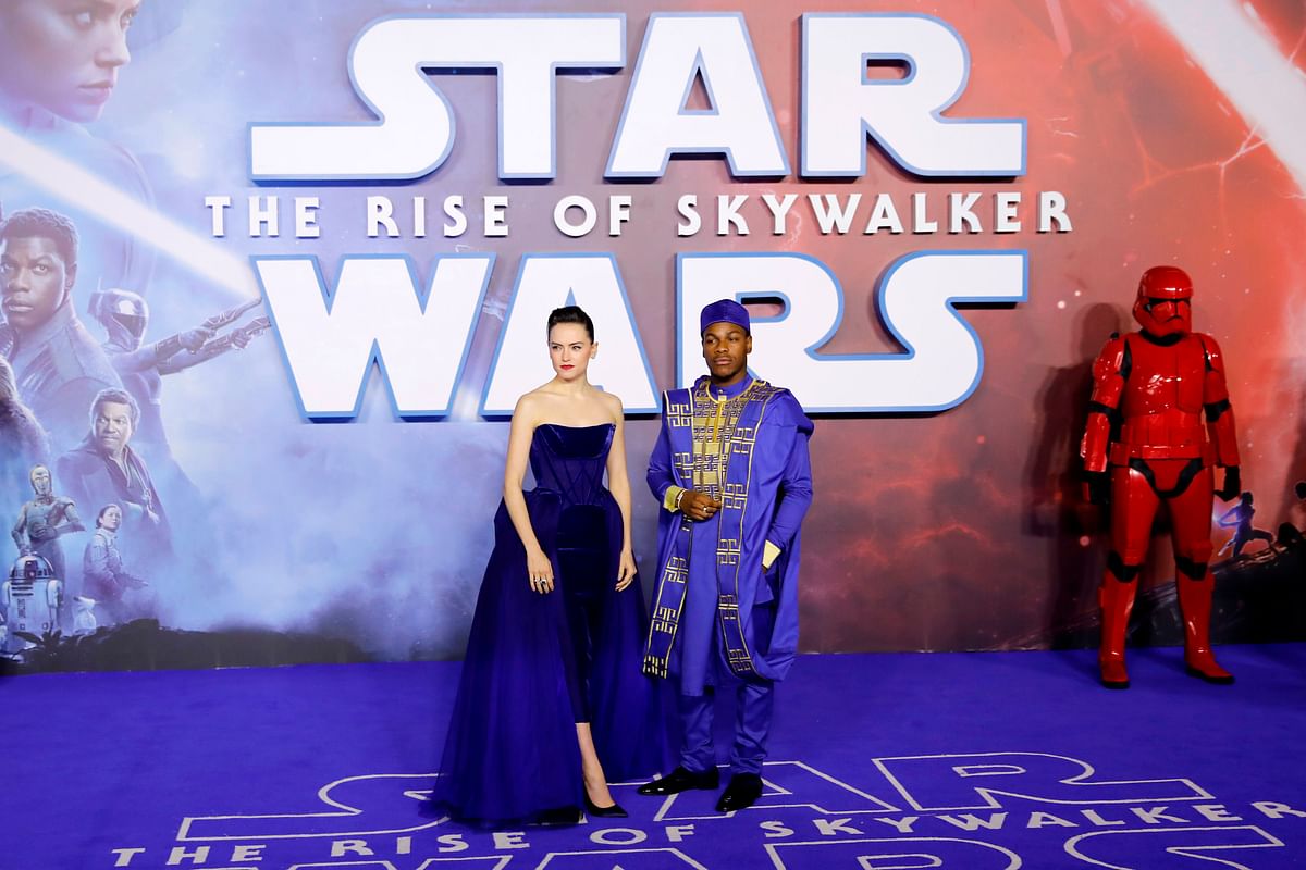 In this file photo taken on 18 December, 2019 British actor Daisy Ridley (L) and British actor John Boyega (R) pose on the red carpet upon arrival for the European film premiere of `Star Wars: The Rise of Skywalker` in London. Photo: AFP
