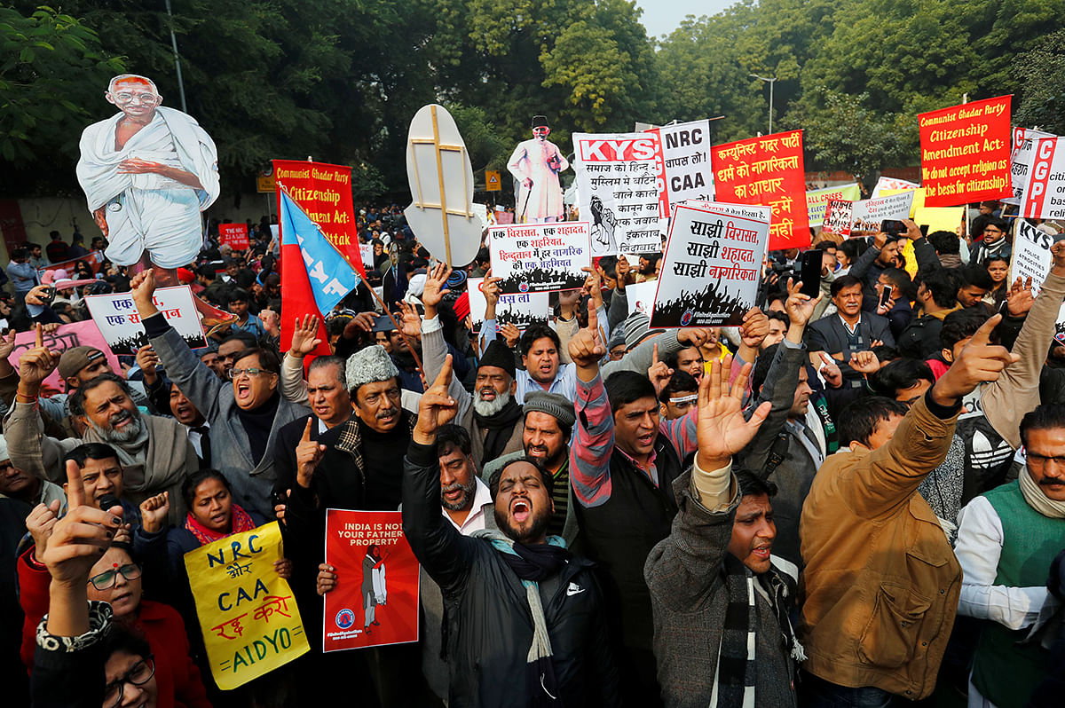 Demonstrators gesture and shout slogans during a protest against a new citizenship law in New Delhi, India, on 24 December 2019. Photo: Reuters