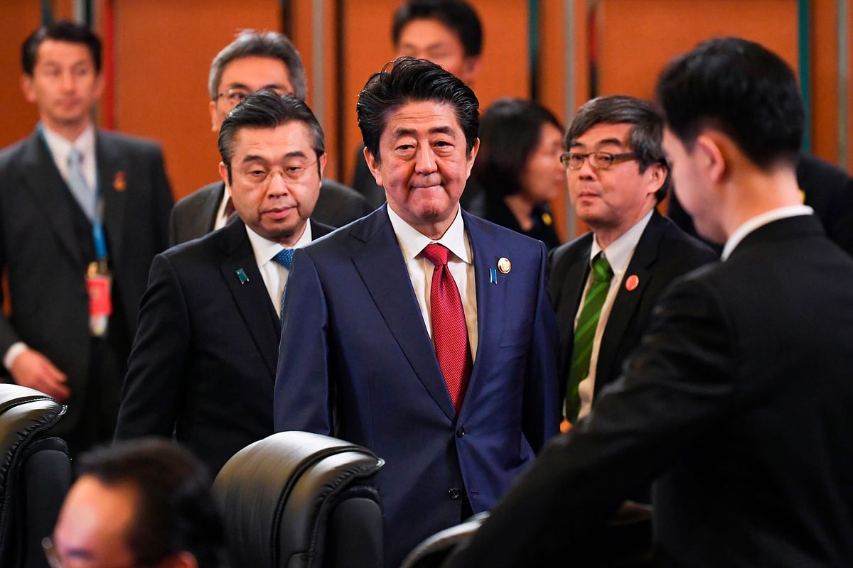 Japan`s prime minister Shinzo Abe (C) attends the 8th trilateral leaders` meeting between China, South Korea and Japan in Chengdu, southwestern China`s Sichuan province on 24 December. Photo: AFP