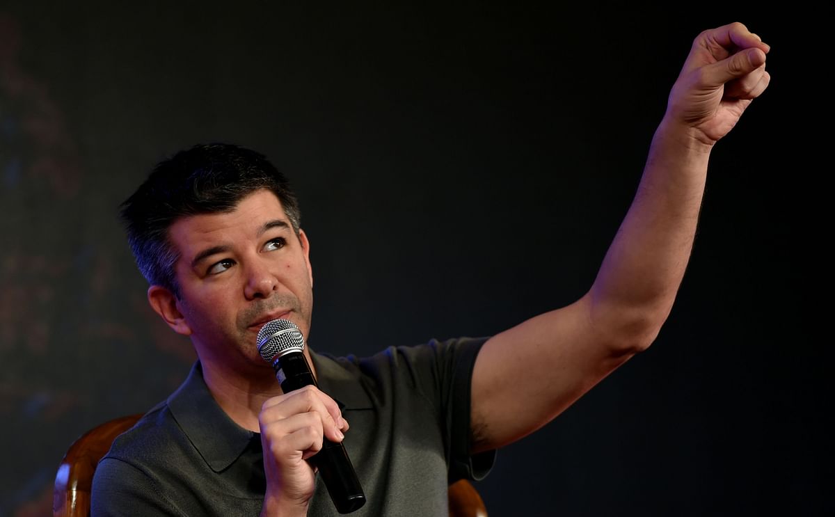 In this file photo taken on 16 December 2016 co-founder and chief executive officer of US tranportation company Uber Travis Kalanick gestures as he speaks at an event in New Delhi. Photo: AFP