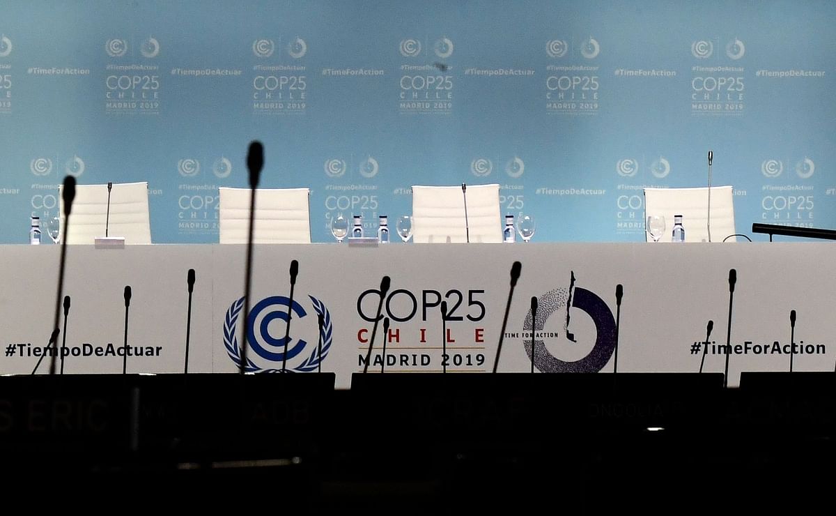 In this file photo taken on 13 December 2019, empty chairs are pictured during the UN Climate Change Conference COP25 at the `IFEMA - Feria de Madrid` exhibition centre, in Madrid. Photo: AFP
