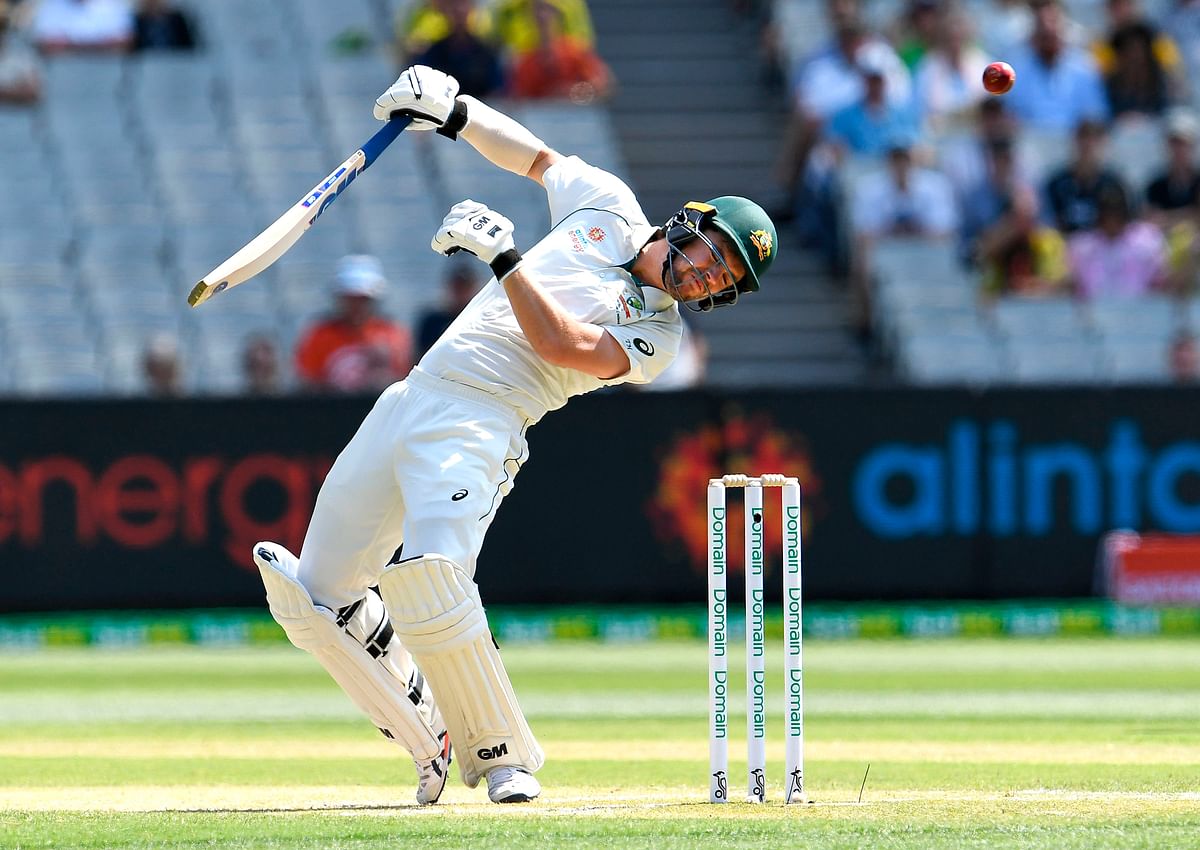 Australia`s batsman Travis Head ducks a bouncer from the New Zealand bowling on the second day of their second cricket Test match at the MCG in Melbourne on 27 December 2019. Photo: AFP