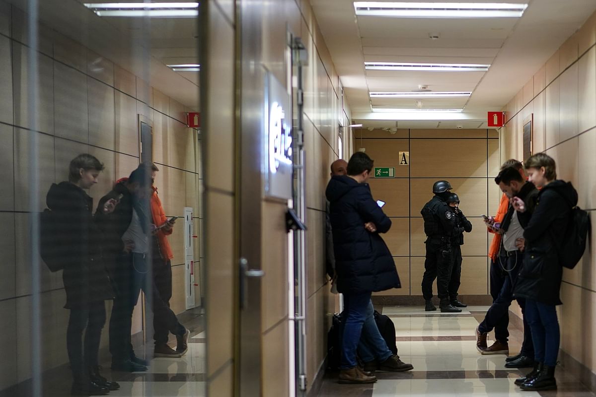 Russian law enforcement agents stand guard at a hallway of a business centre, which houses the office of opposition leader Alexei Navalny`s Anti-Corruption Foundation (FBK), in Moscow on 26 December 2019. Photo: AFP