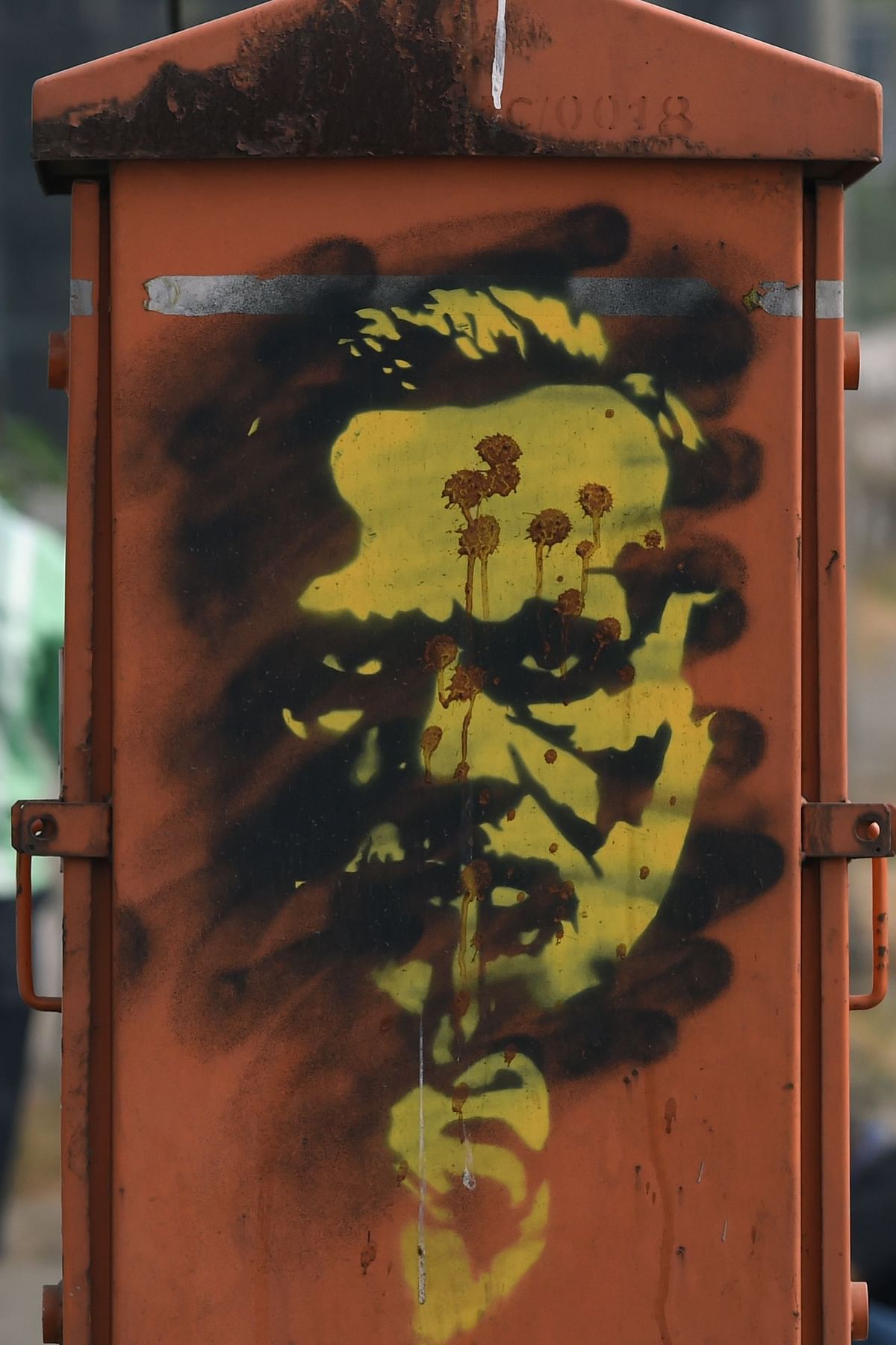 Graffiti of Indian prime minister Narendra Modi, splashed with betel leaf juice, created by street artist `Tyler` in the wake of nationwide protests against India`s new citizenship law is pictured in Mumbai on 24 December 2019. Photo: AFP