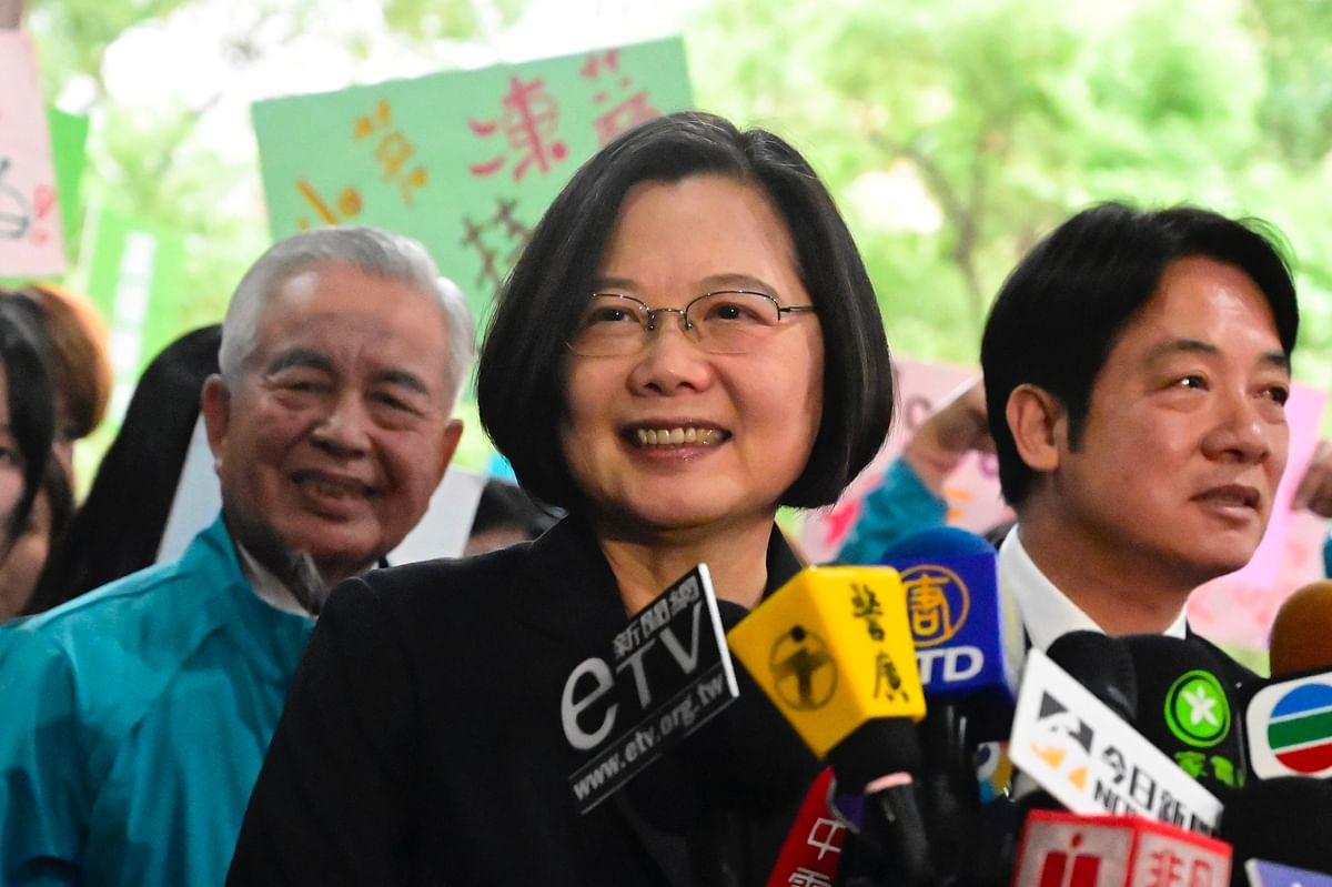 Cap In this file photo taken on 19 November, Taiwan`s president Tsai Ing-wen (C) speaks after registering as a presidential candidate outside the Central Elections Committee in Taipei. Photo: AFP
