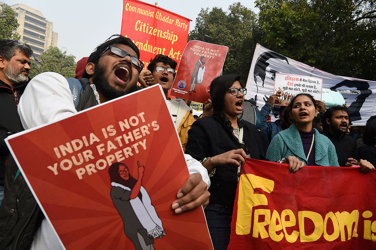 In this photo taken on 24 December 2019, protesters hold placards at a demonstration against India`s new citizenship law in New Delhi. Photo: AFP
