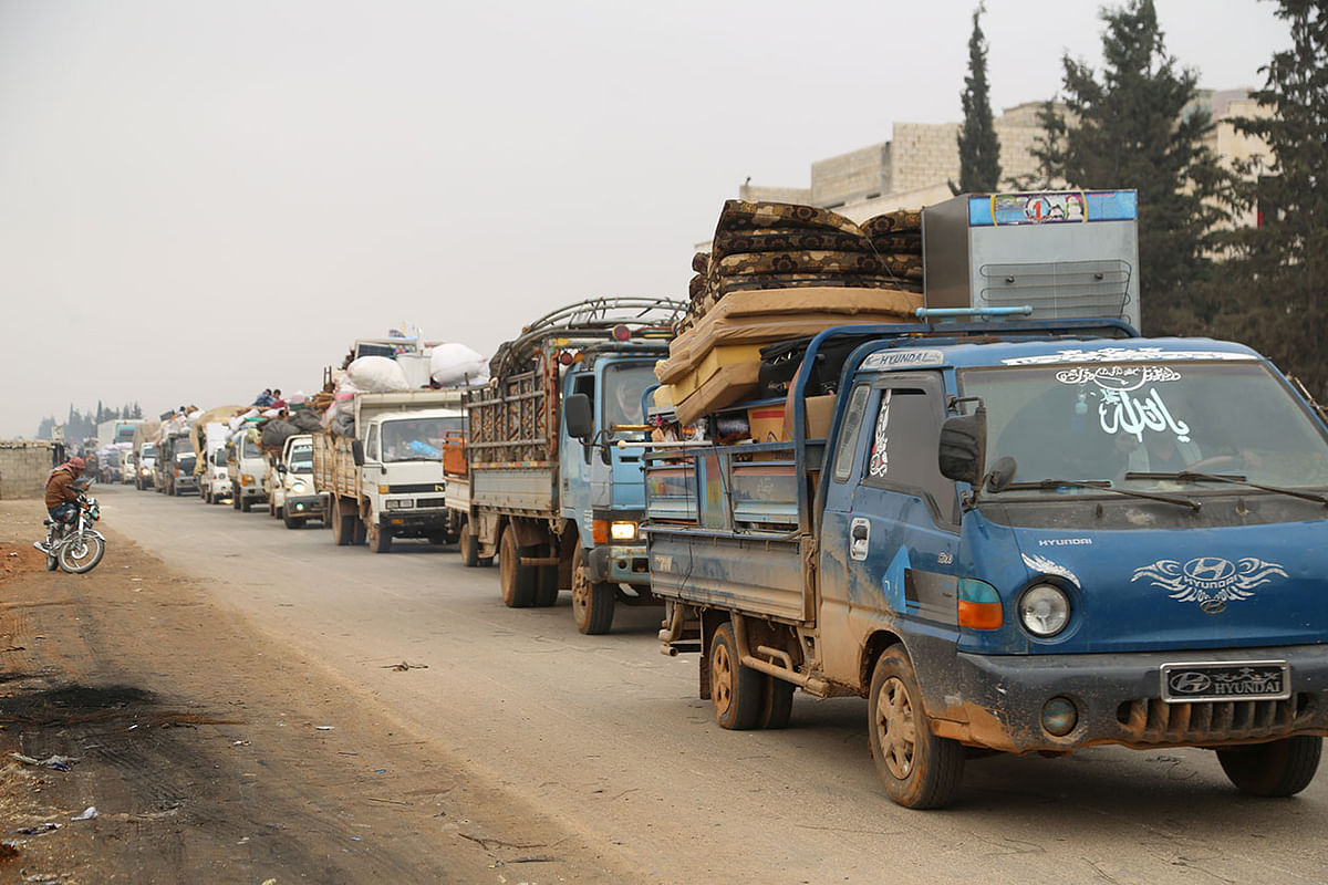 Trucks carry belongings of people fleeing from Maarat al-Numan, in northern Idlib, Syria on 24 December 2019. Photo: Reuters