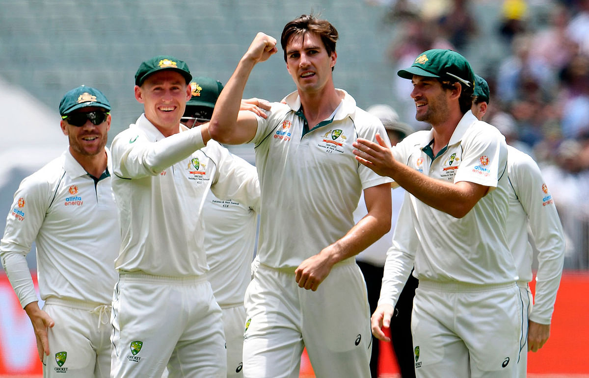 Australian paceman Pat Cummins (C) gestures to New Zealand fans after dismissing New Zealand batsman Tom Latham on the third day of the second cricket Test match at the MCG in Melbourne on 28 December 2019. Photo: AFP