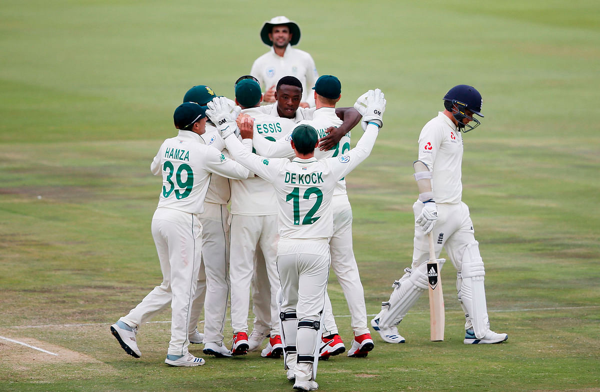 South Africa`s Kagiso Rabada (C) celebrates with teammates after the dismissal of England`s Sam Curran (R) during the fourth day of the first Test cricket match between South Africa and England at The SuperSport Park stadium at Centurion near Pretoria on Sunday. Photo: AFP