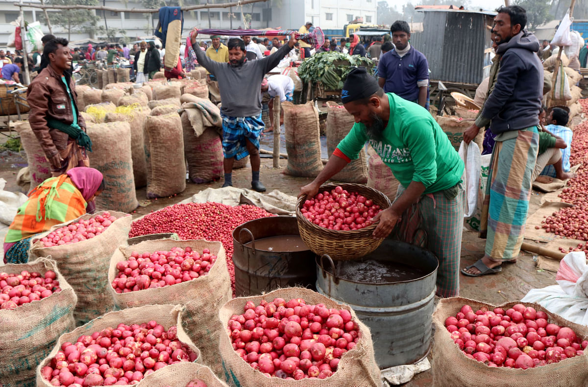 Traders clean potato harvests before selling them in Mahasthan, Bogura recently. Photo: Soel Rana