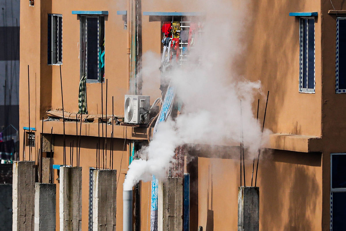 Smokes belch out of a factory chimney housed in a residential area at Pannitola, Koilash Ghosh Lane, Old Dhaka on 30 December 2019. Photo: Dipu Malakar