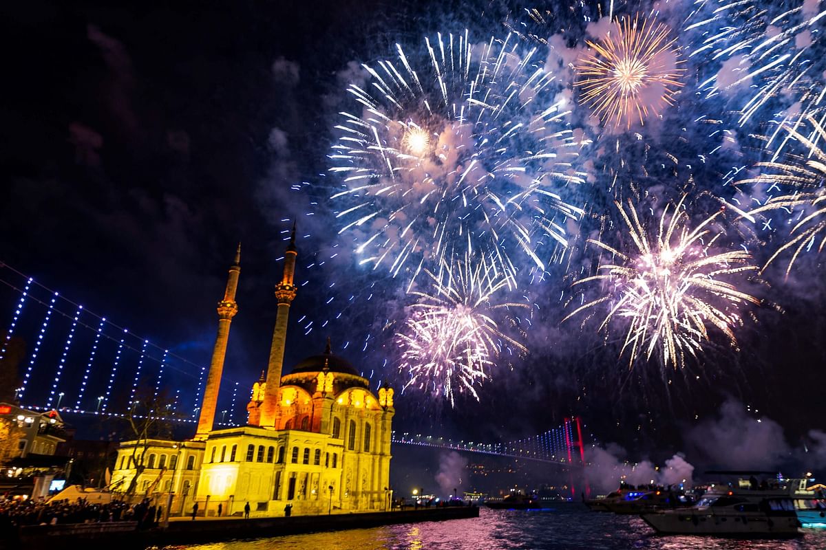 Fireworks explode in the sky over the Ortakoy Mosque by the 15 July Martyrs` Bridge during the New Year`s celebrations, in Istanbul on 1 January 2020. Photo: AFP
