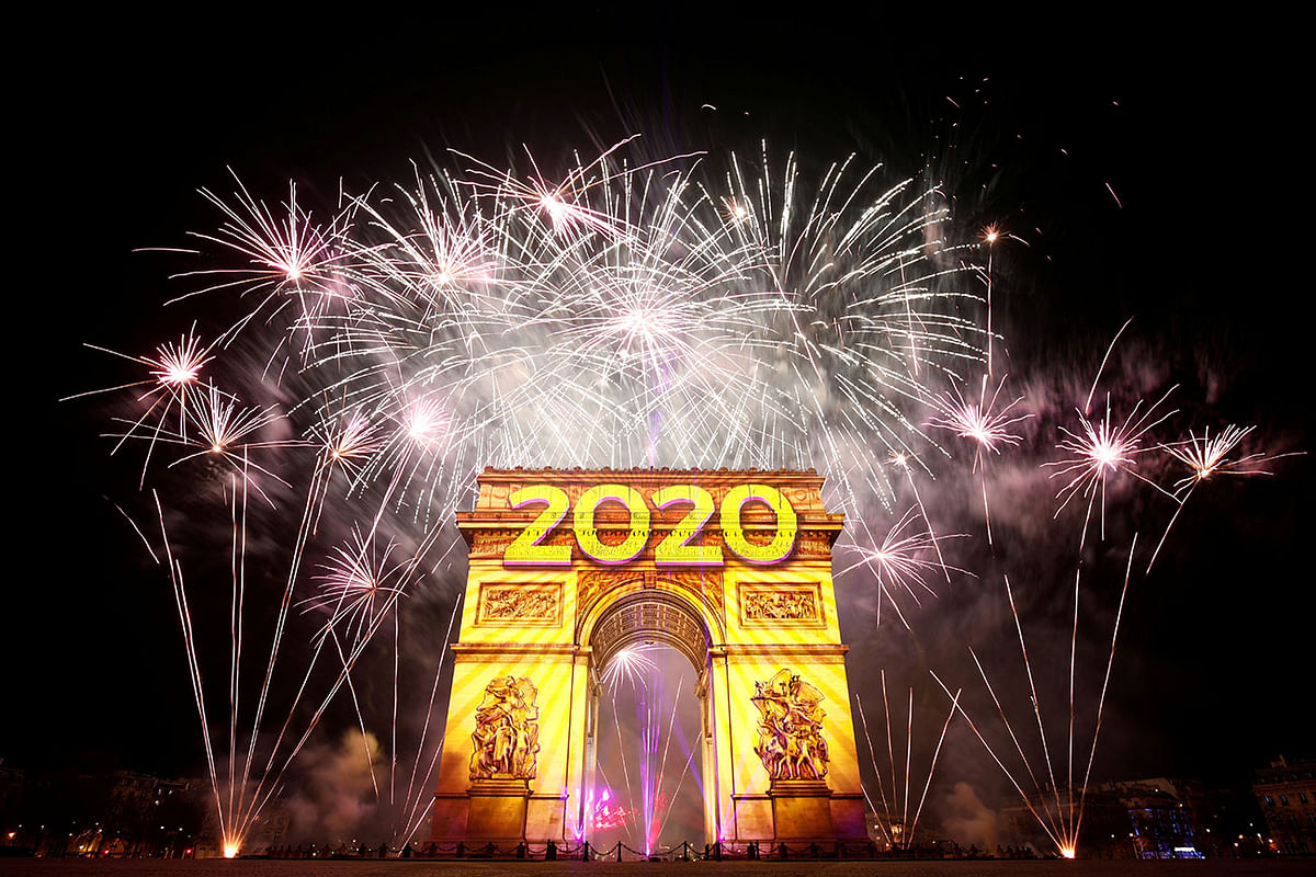 Fireworks illuminate the sky over the Arc de Triomphe during the New Year`s celebrations on the Champs Elysees in Paris. Photo: Reuters