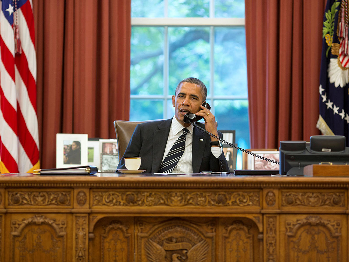 US president Barack Obama talks with Iranian president Hassan Rouhani during a phone call in the Oval Office at the White House in Washington on 27 September 2013. Reuters File Photo