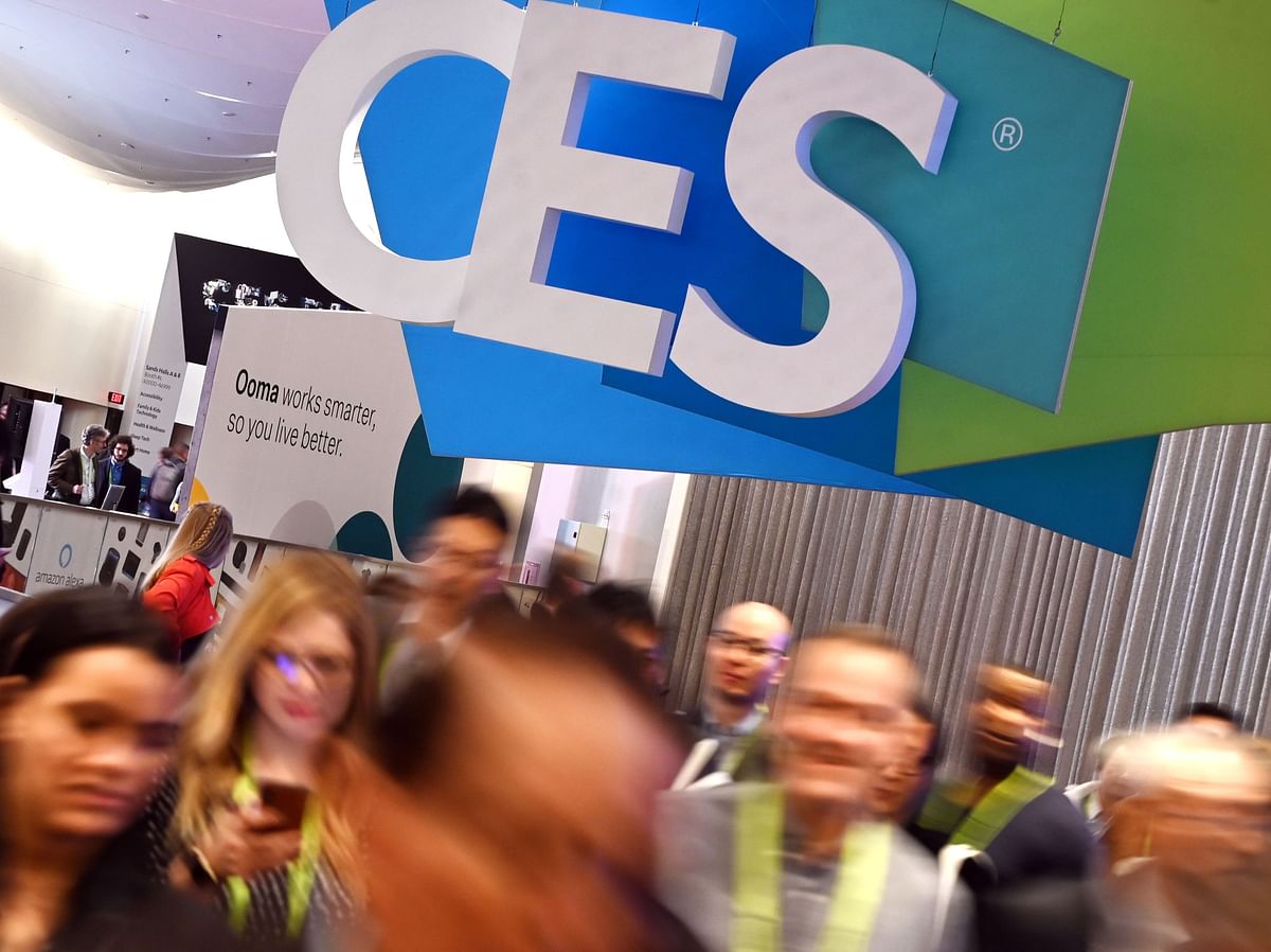 In this file photo taken on 10 January 2019, attendees walk through the hall at the Sands Expo Convention Center during CES 2019 consumer electronics show in Las Vegas, Nevada. Photo: AFP