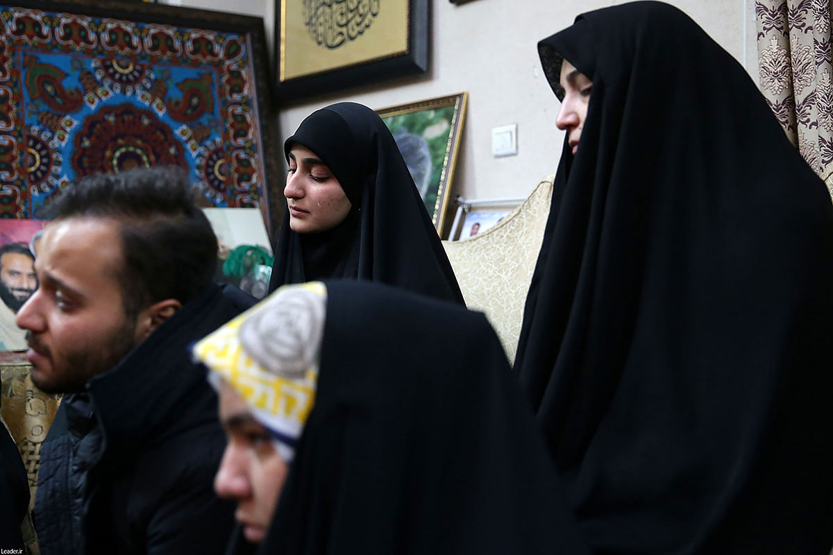 A handout picture provided by the office of Iran`s Supreme Leader Ayatollah Ali Khamenei on 3 January, 2020, shows members of the family of killed Iranian Revolutional Guards commander Qasem Soleimani reciting during the visit of Iran`s supreme leader to their home in the capital Tehran. Photo: AFP