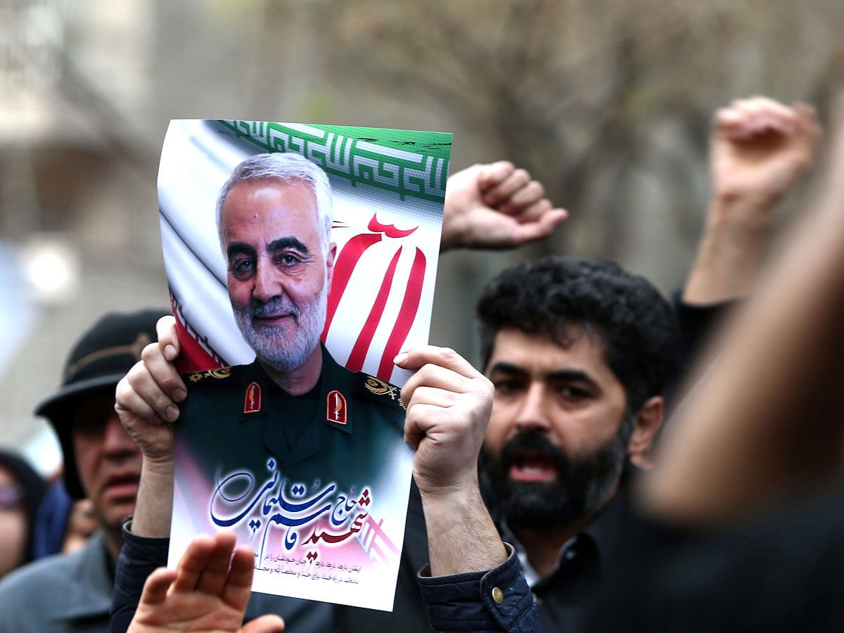 Iranian demonstrators chant slogans during a protest against the killing of the Iranian major-general Qassem Soleimani, head of the elite Quds Force, and Iraqi militia commander Abu Mahdi al-Muhandis, who were killed in an air strike at Baghdad airport, in front of United Nations office in Tehran, Iran on 3 January 2020. Reuters File Phot