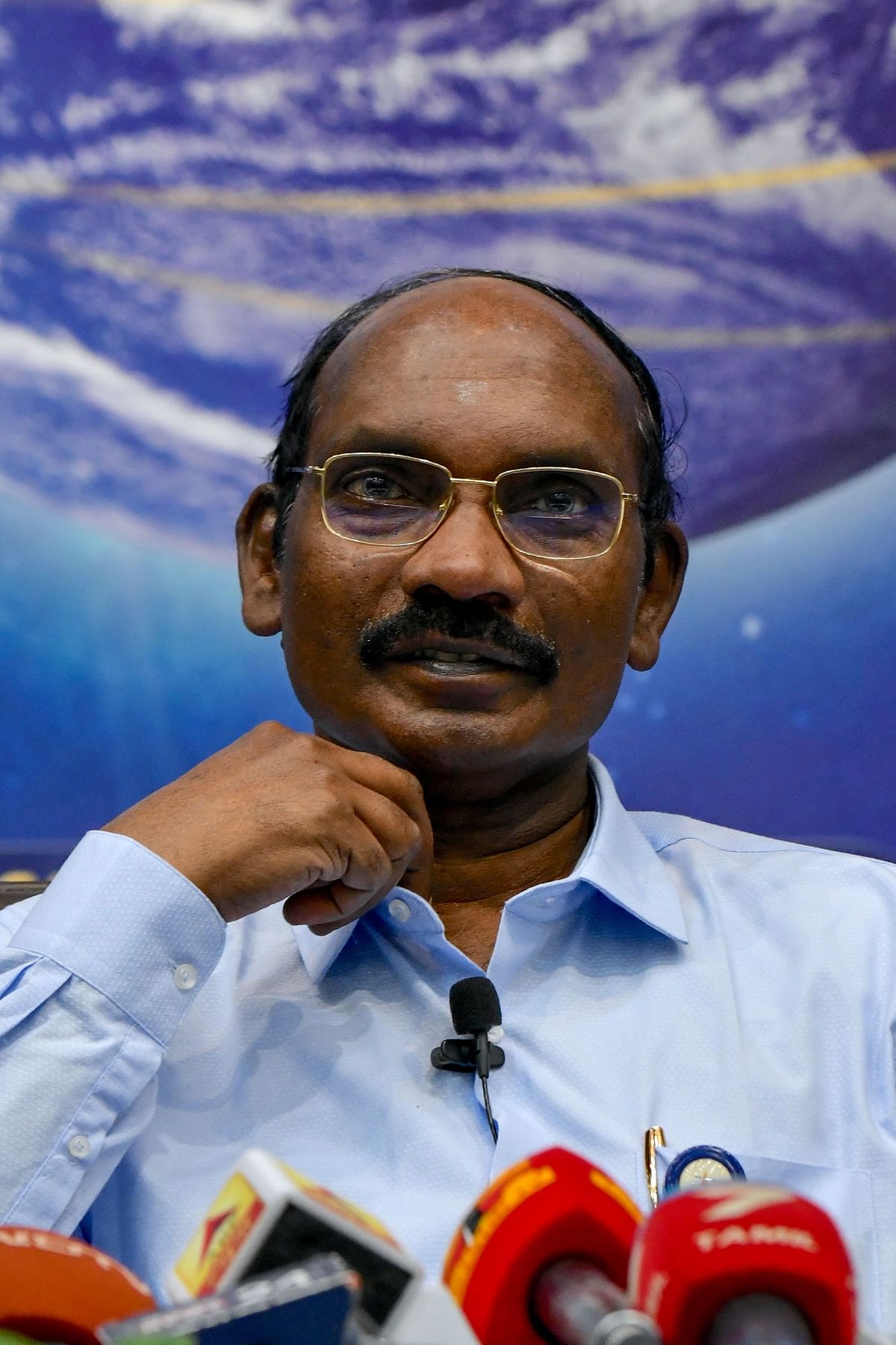 Chairman of the Indian Space Research Organisation (ISRO) Kailasavadivoo Sivan gestures as he announces ISRO`s plans for 2020 including the progress in `Chandrayaan 3` moon mission and `Gaganyaan` mission for putting an Indian astronaut into space, during a press conference held at the ISRO headquarters in Bangalore on 1 January 2020. Photo: AFP